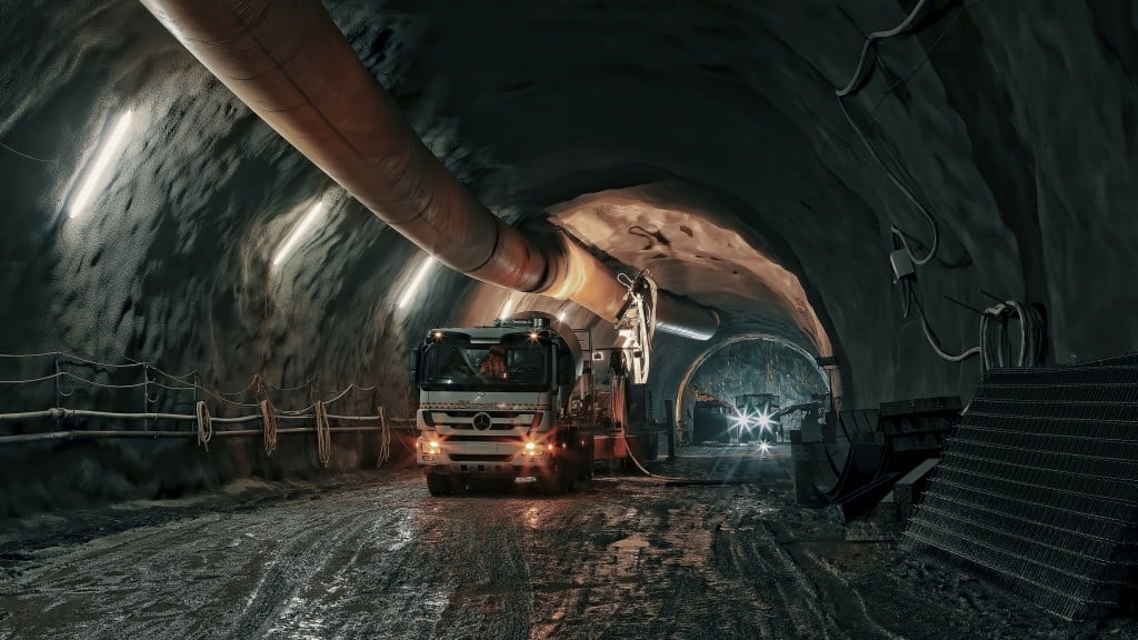 A truck drives down a tunnel