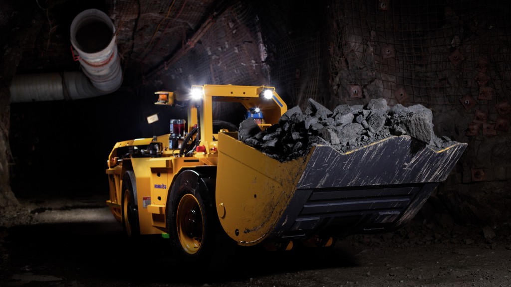 A LHD hauls rock through a small tunnel