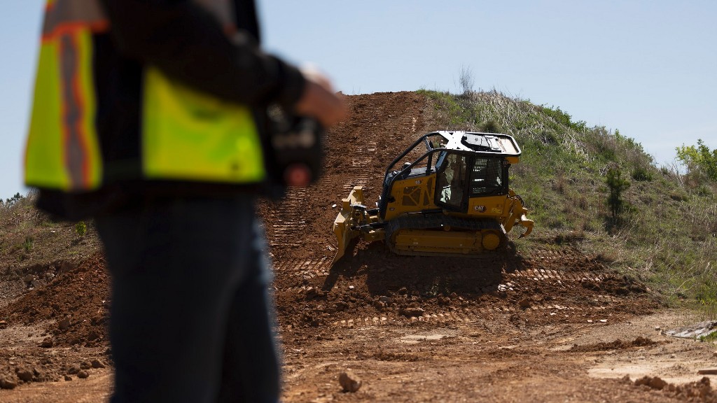 An operator controls a dozer remotely