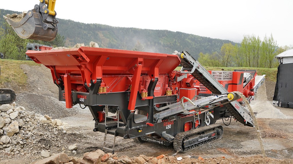 An impact crusher being loaded in a quarry