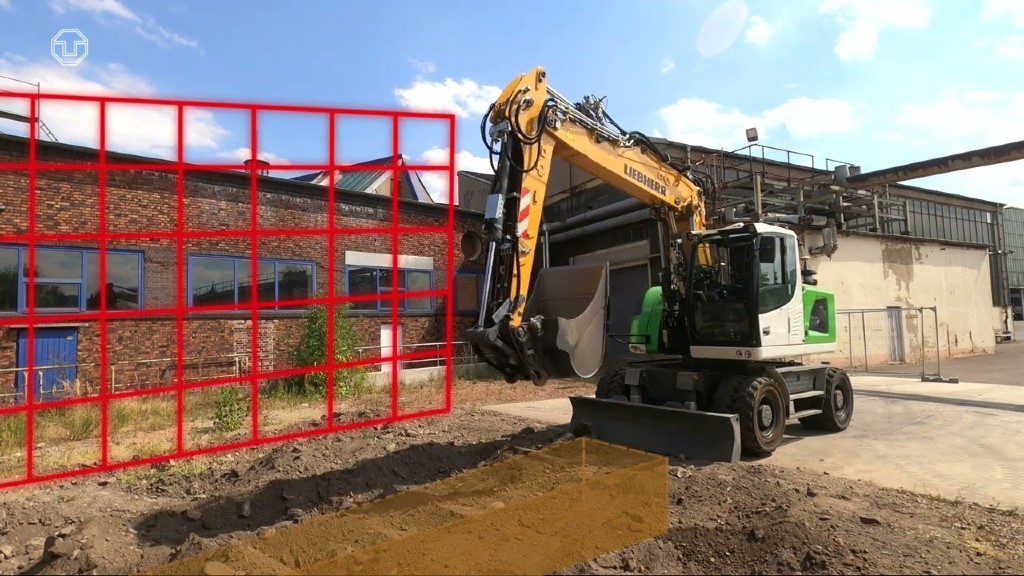 A wheeled excavator digs a trench on a job site