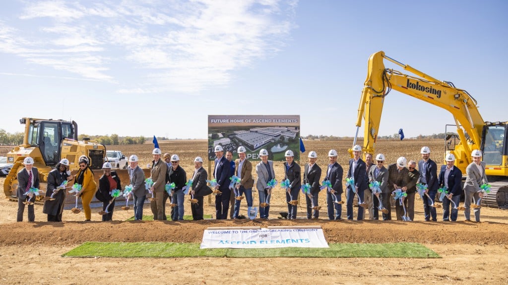 Several people pose for a photo with shovels at a groundbreaking event