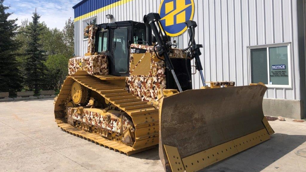 A camouflage Cat D6T XW dozer is one of six machines that contribute to Wounded Warriors Canada through their rental fees.