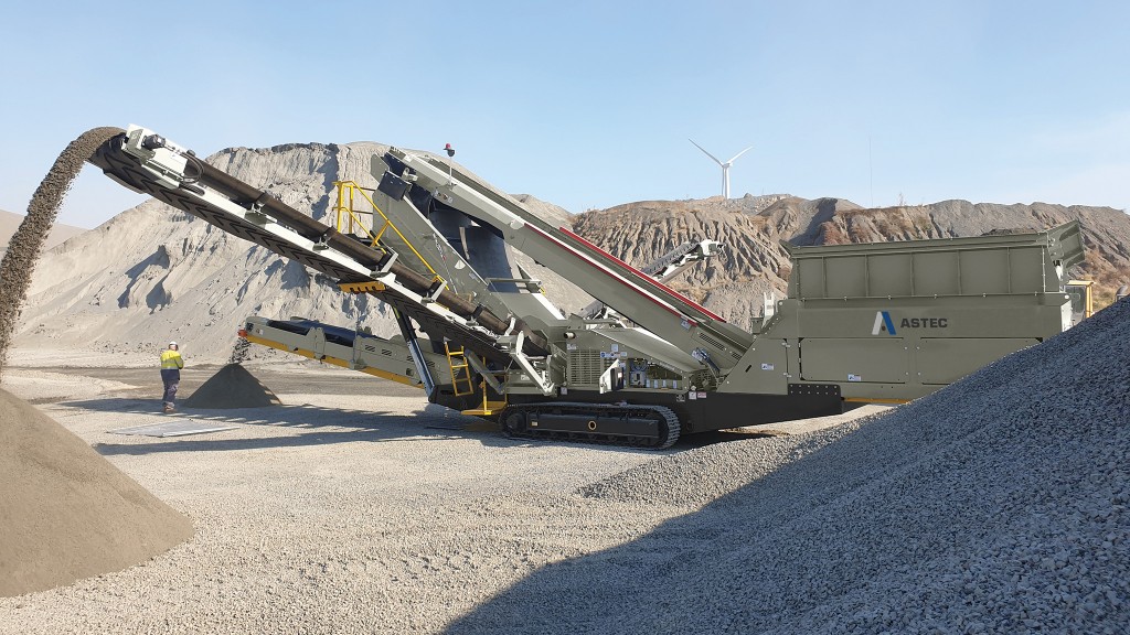 A screening plant screens rock material on a job site