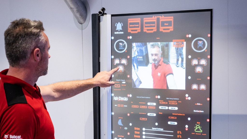 A man uses a transparent touchscreen display