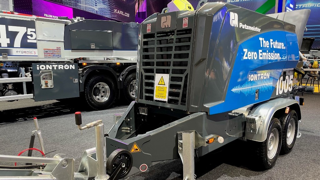 A concrete pump is parked inside a large building