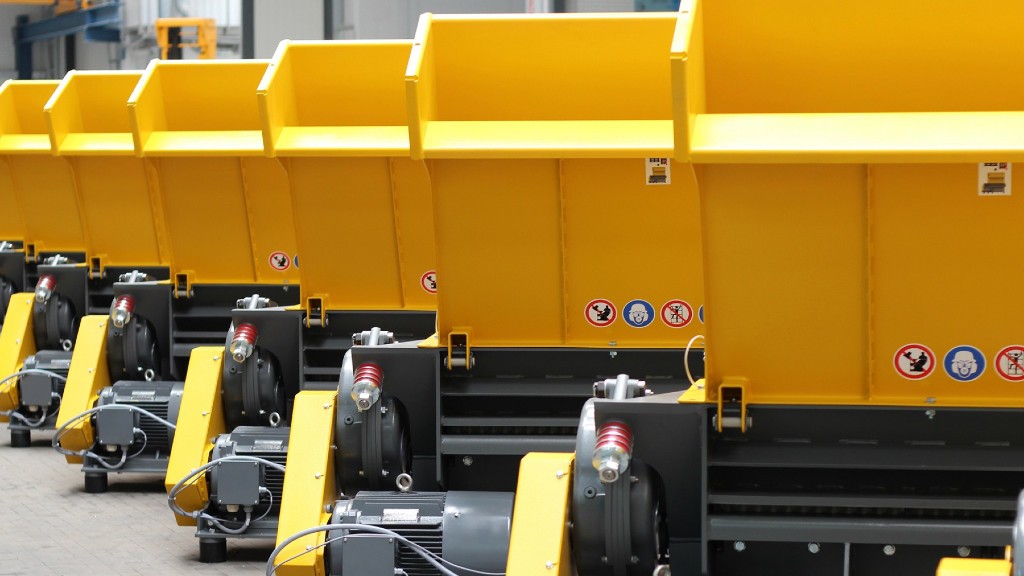 Industrial shredders are parked in a line
