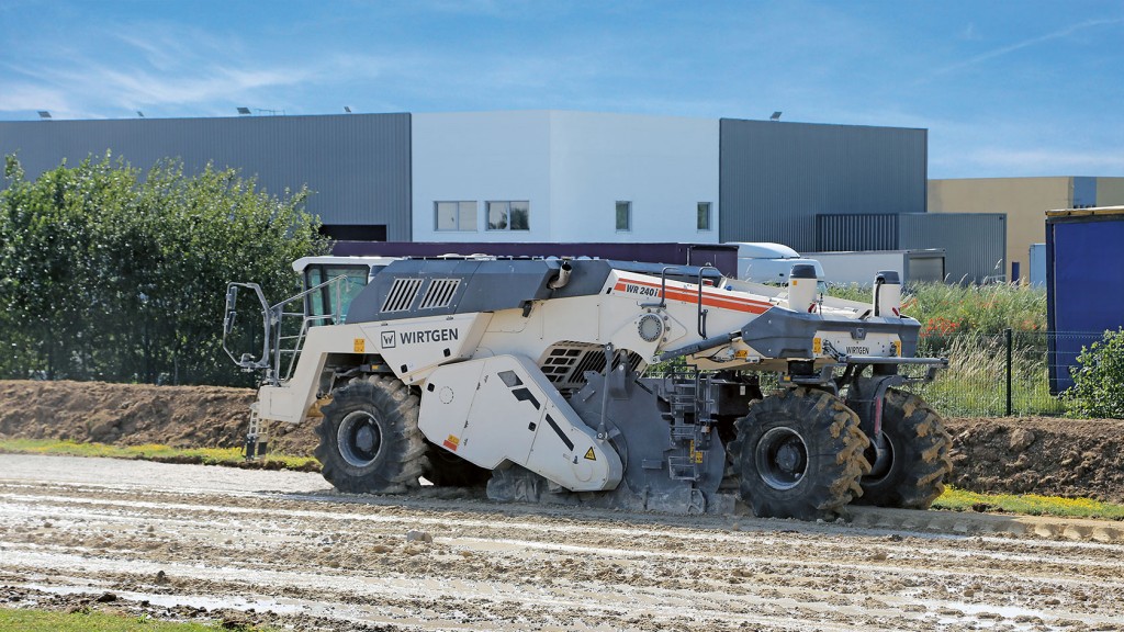 A soil stabilizer working on a job site A soil stabilizer working on a job site