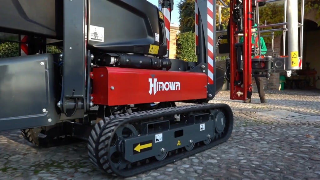 A aerial work platform moves on a job site