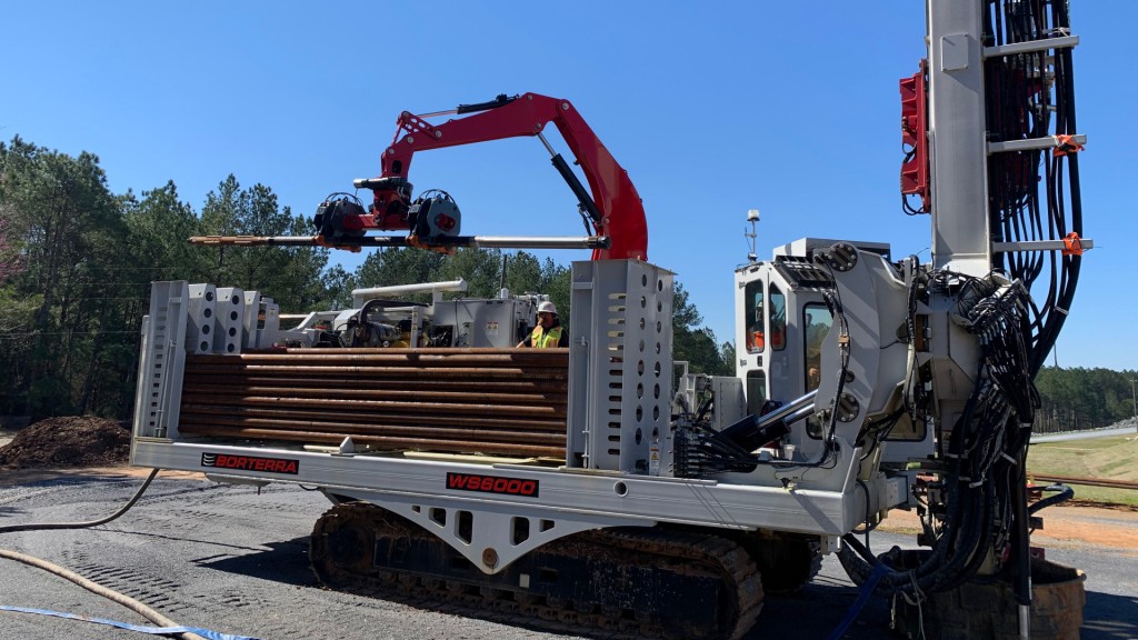 A robotic rod handling unit mounted on a tracked drill.