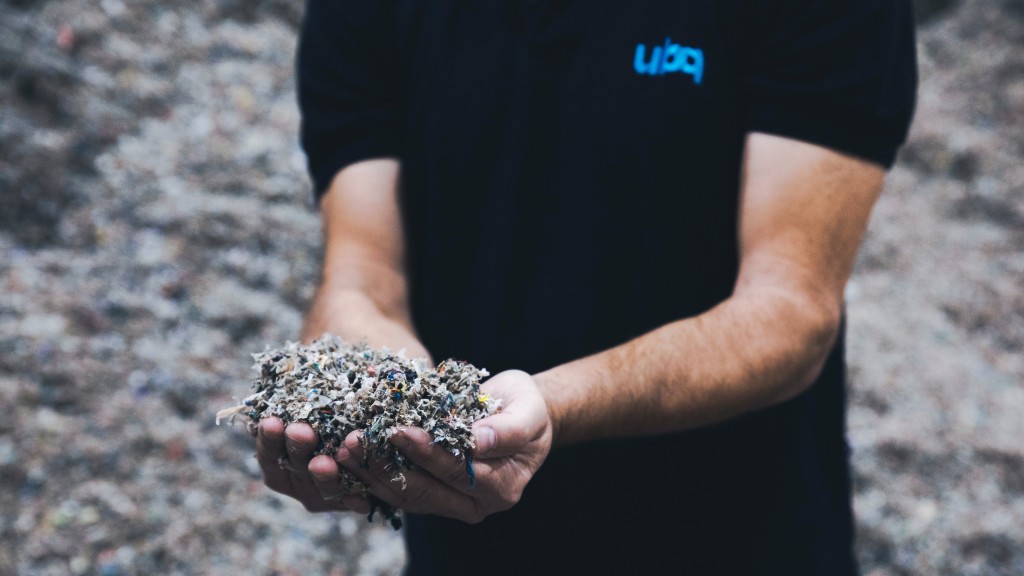 Somebody holds shredded mixed waste in their hands