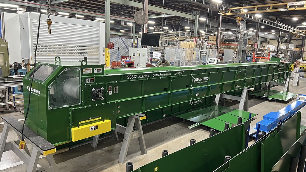 A stainless steel separation conveyor inside a manufacturing facility