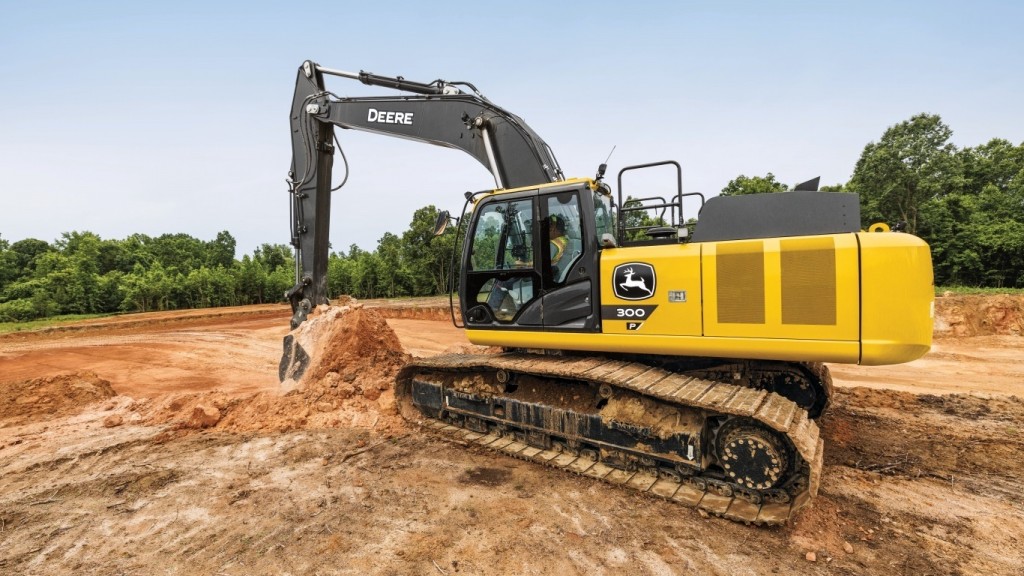 A yellow and black excavator sitting on a job site.