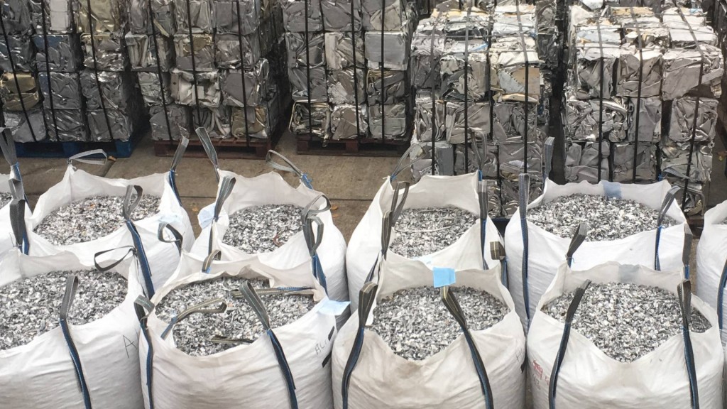 Bags of shredded metal is stored inside a building