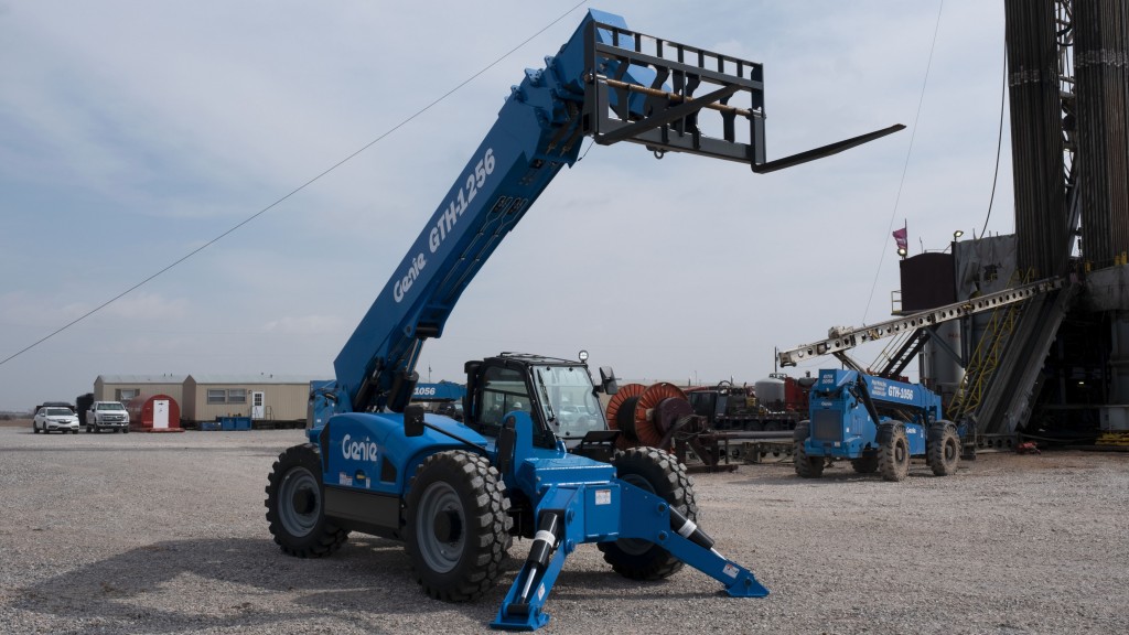 A telehandler is parked in a parking lot