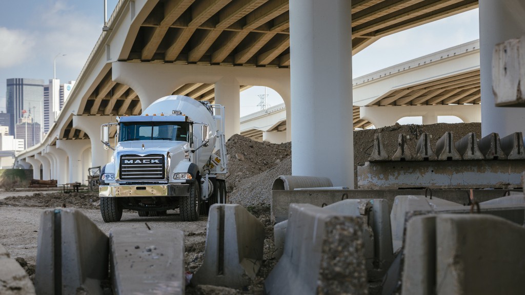 A mixer truck is parked on a job site