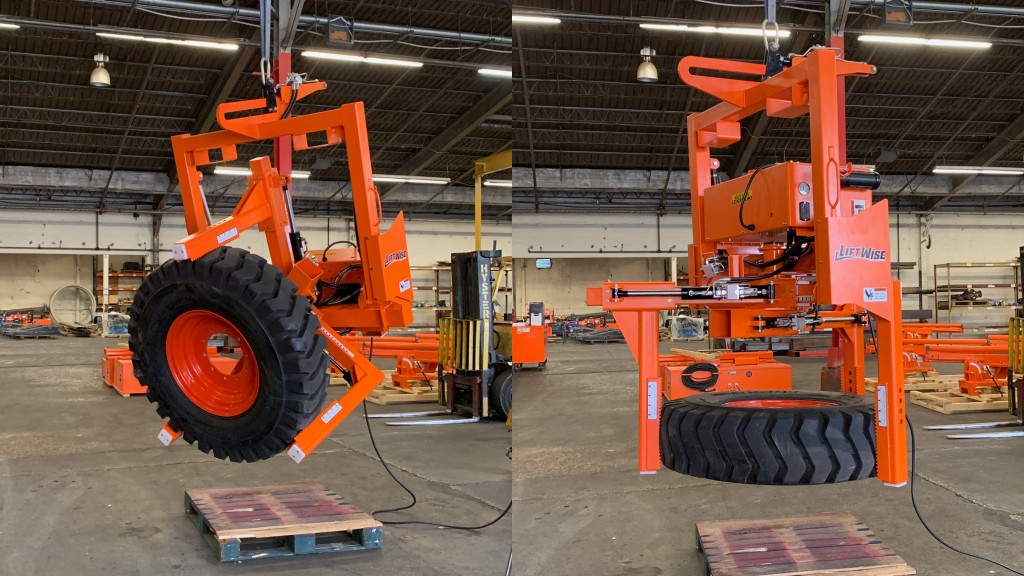 A hanging tire handler moves a tire inside a building