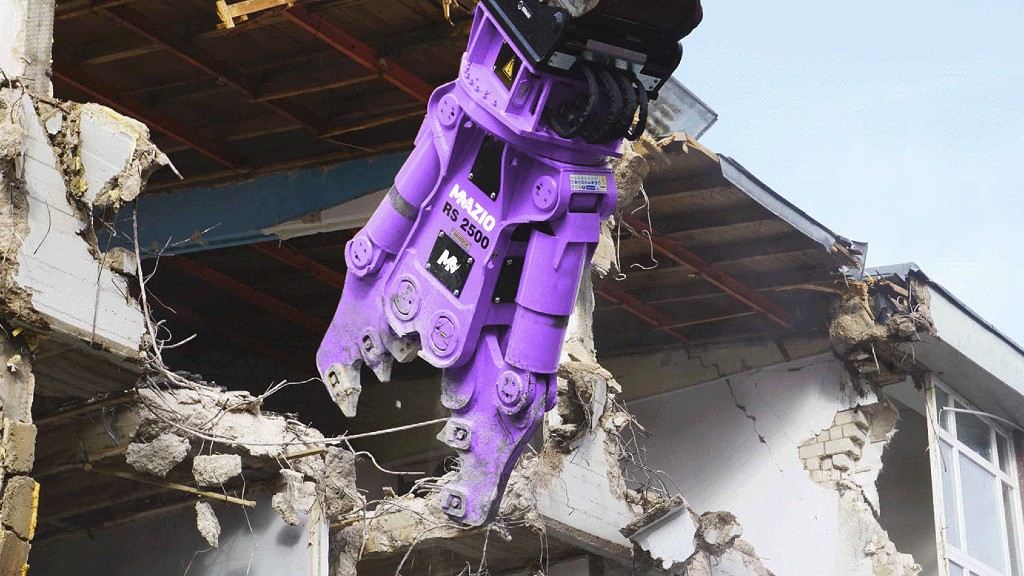 A crusher attachments crushes an old building