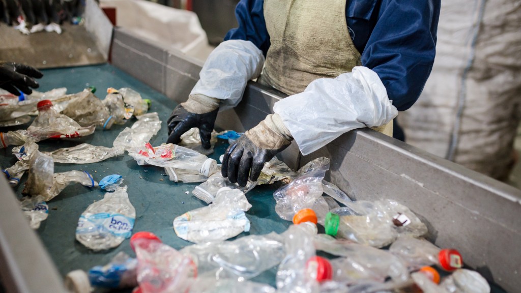 Squised plastic bottles on a conveyor are being sorted