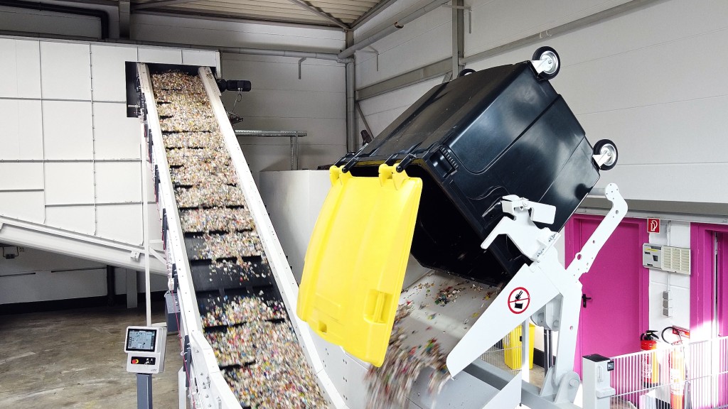 Shredded plastic is dumped onto a conveyor