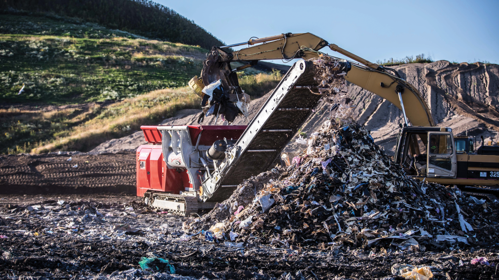 A shredder shreds waste on a job site