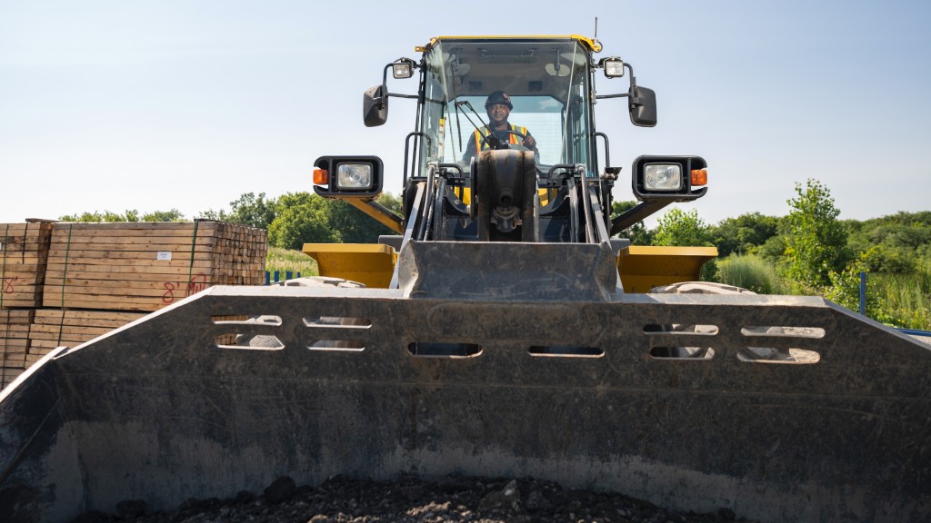 An operator drives a wheel loader