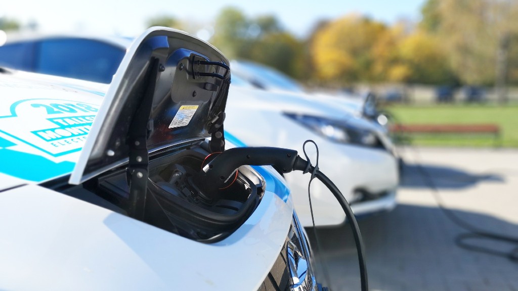 An EV is charging in a parking lot