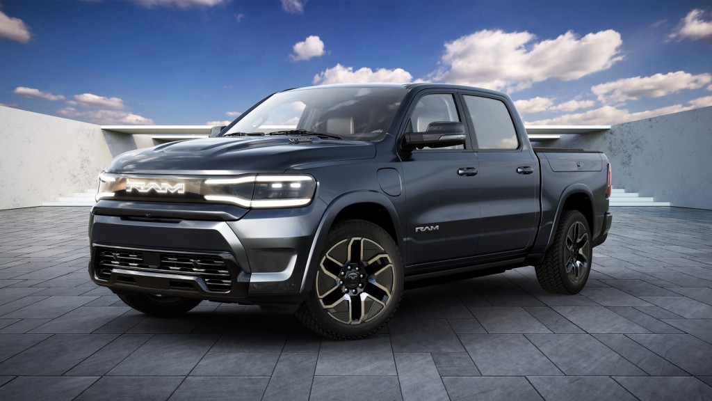 A black pickup on a concrete parking pad.