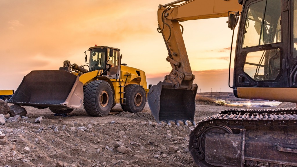 A wheel loader and an excavator are parked on a job site
