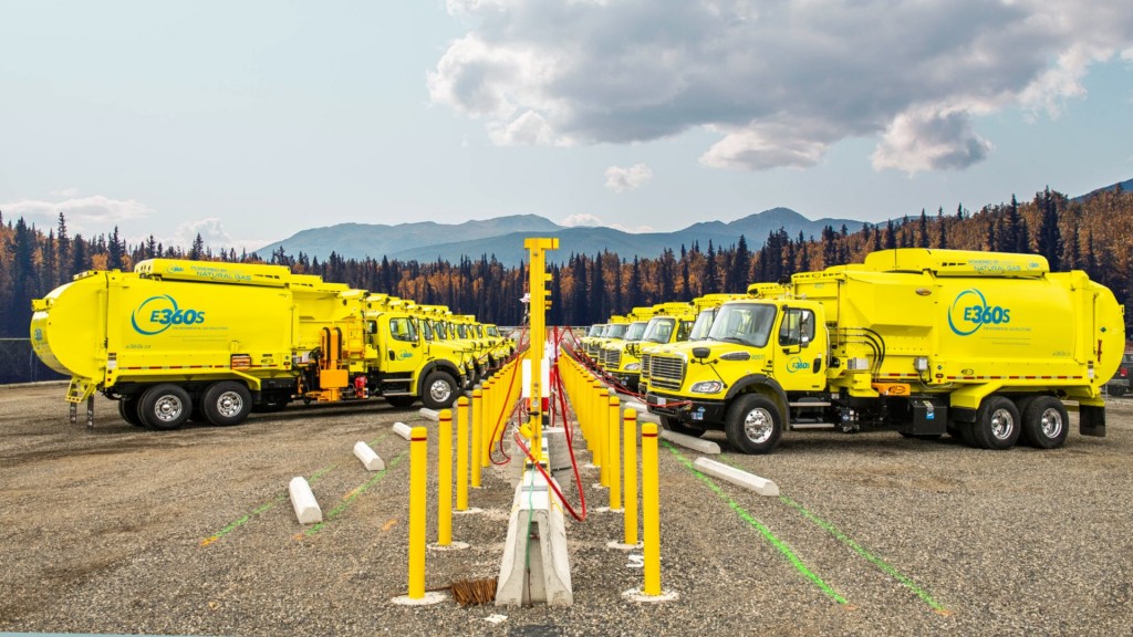 Collection trucks are parked in a line