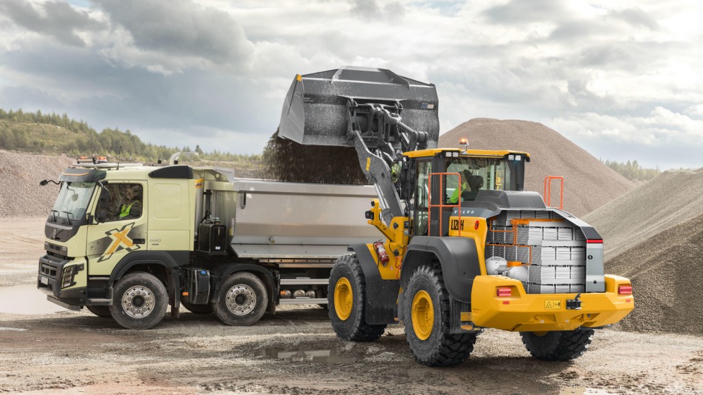 A wheel loader loading a truck