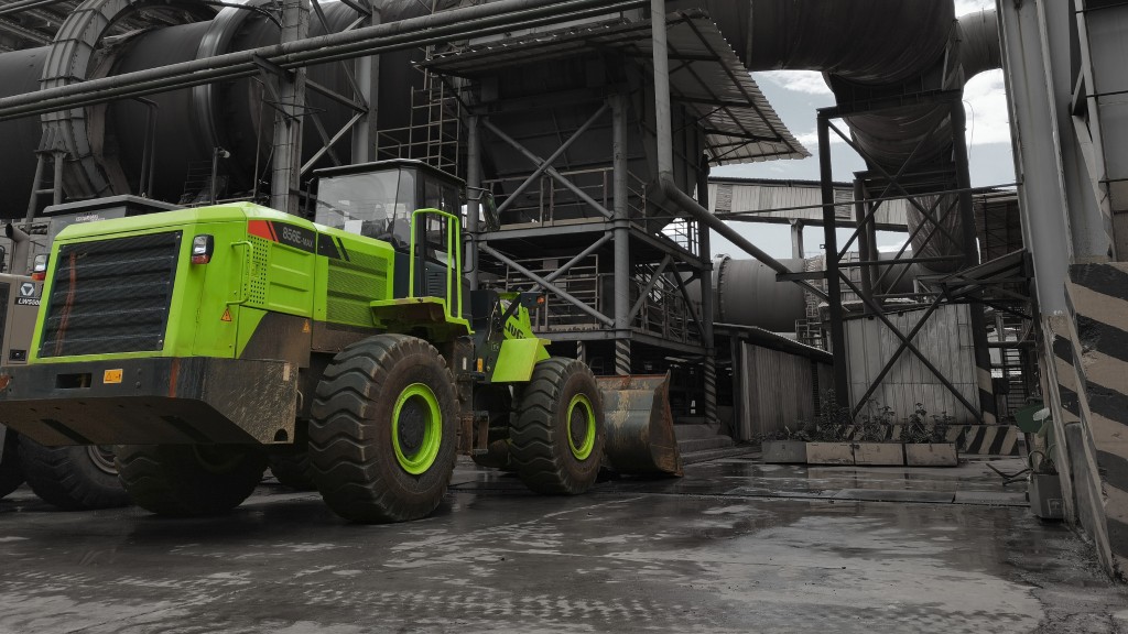 A wheel loader is parked at a factory