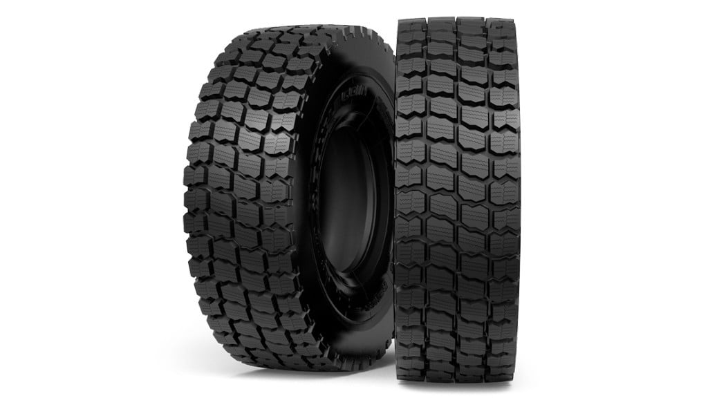 Two tires stand on a white background