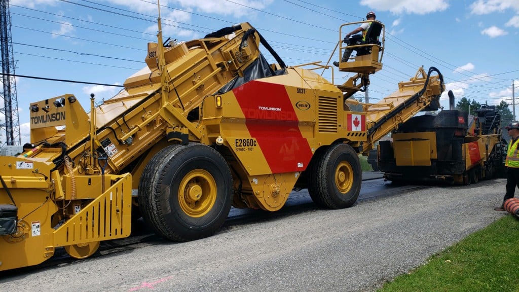 A material transfer vehicle working on a paving job site.