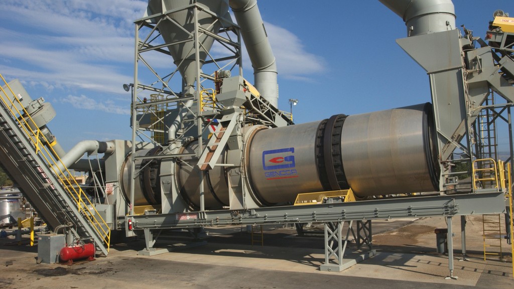 An asphalt drum mixer on a job site