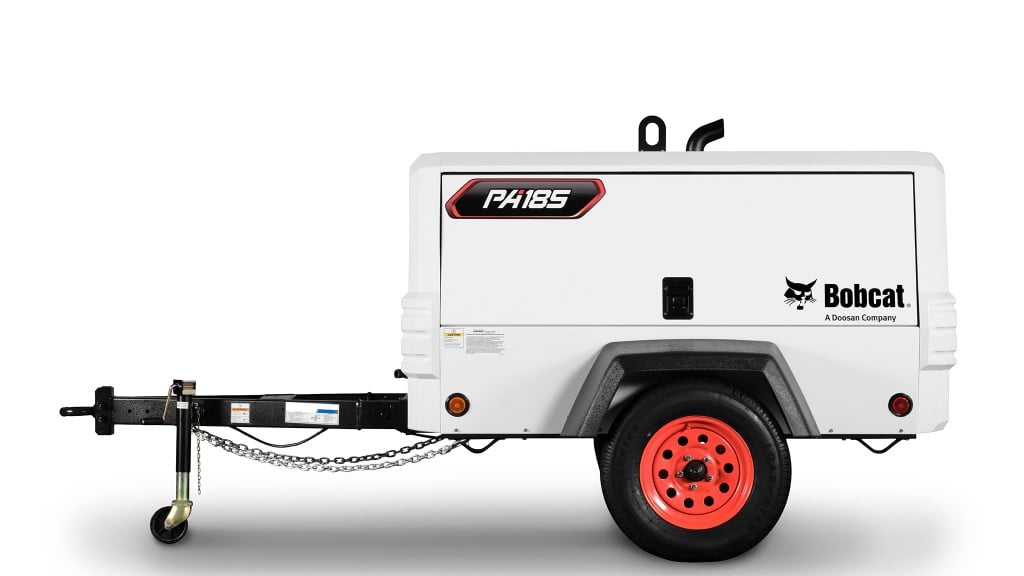 A portable air compressor in front of a white background