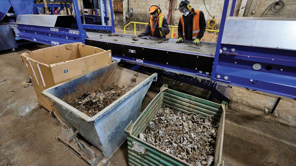 Metal is stored in a bin near a conveyor