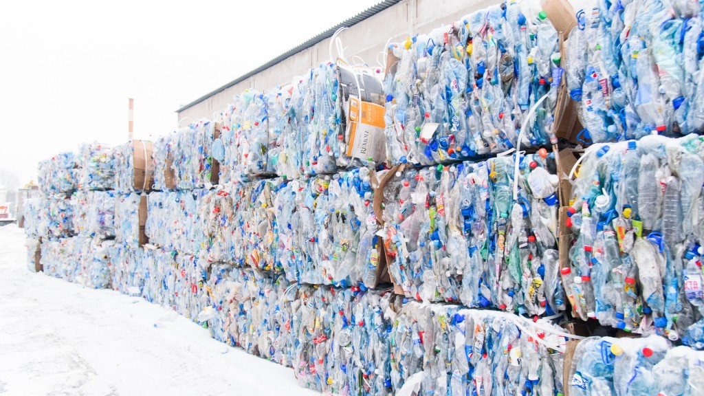 Bales of plastic sit out in the snow