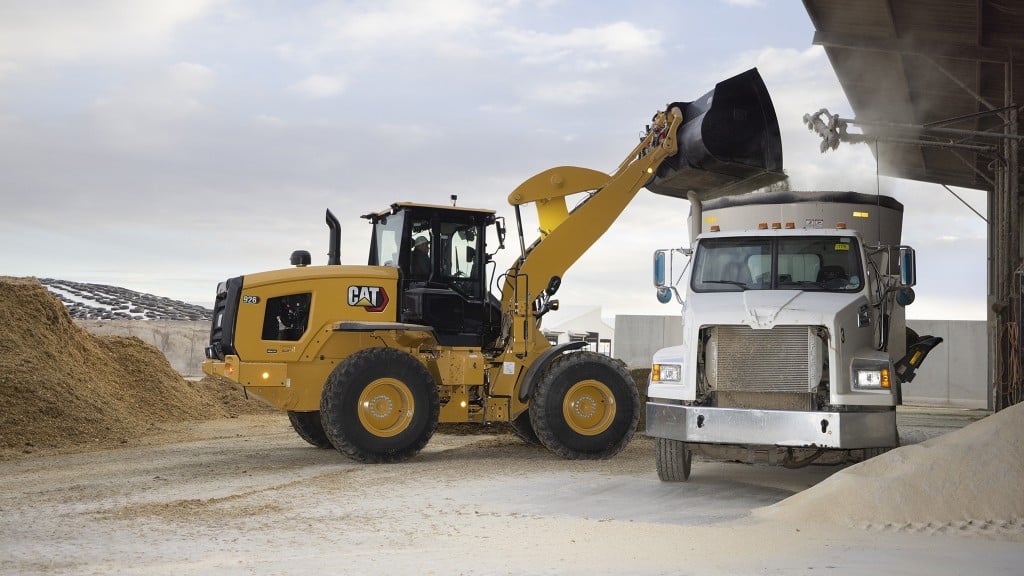 A wheel loader loading a dump truck