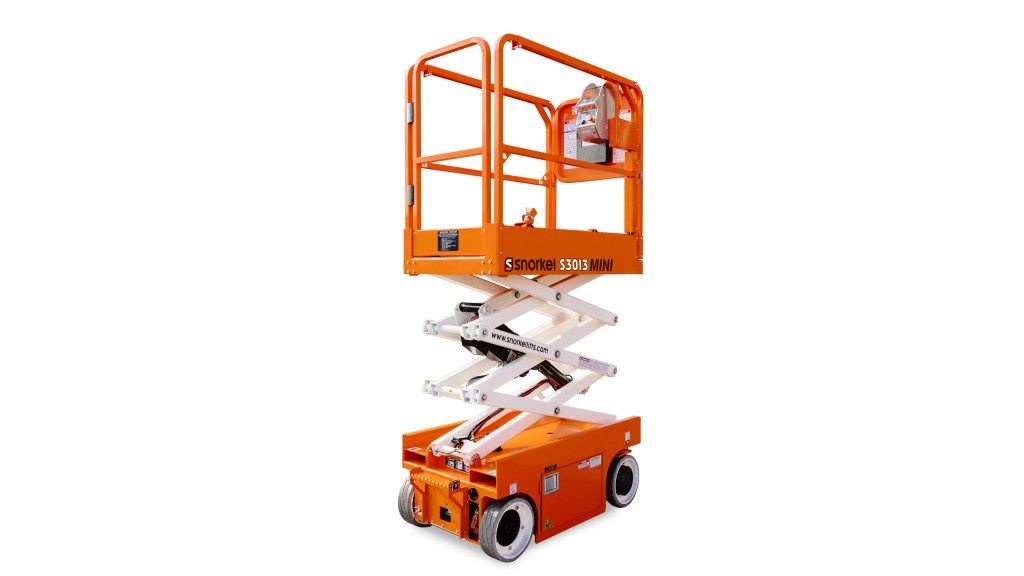 A scissor lift is parked on a white background