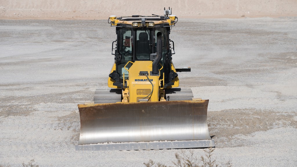 An autonomous dozer operates on a job site