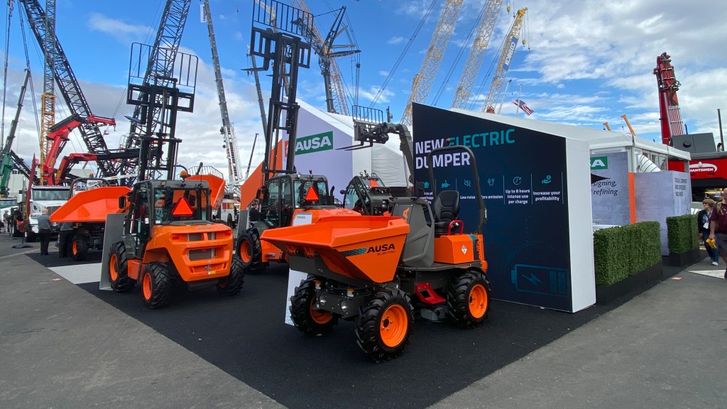 A CONEXPO-CON/AGG booth full of electric site dumpers
