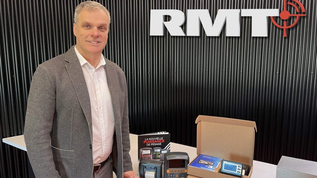 Martin Gaboury stands near a table of RMT technology