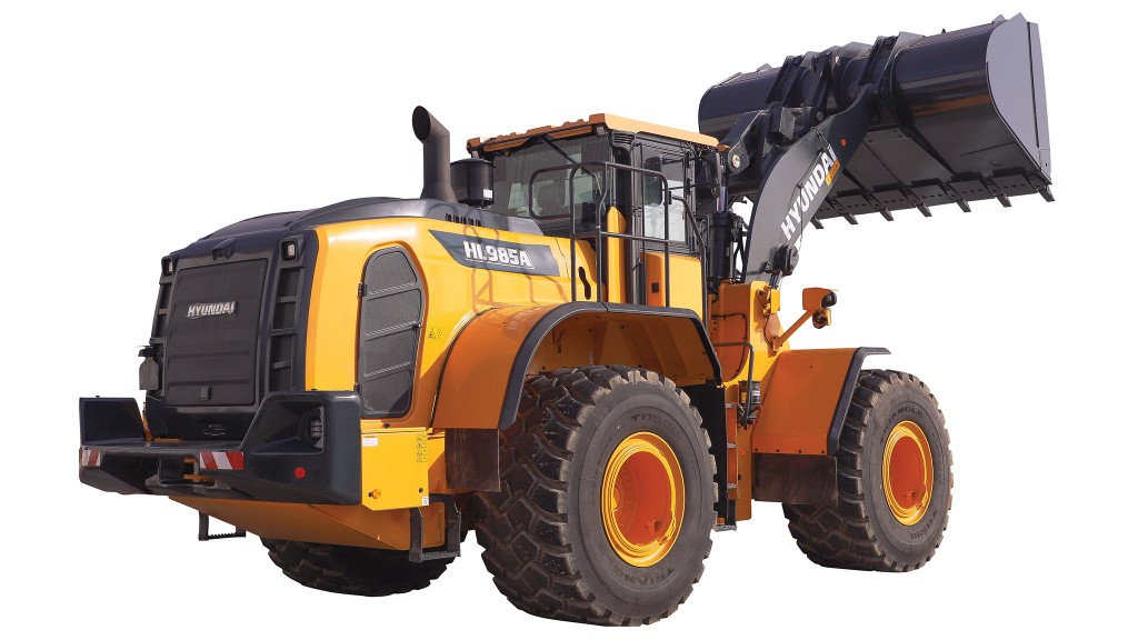 A wheel loader against a white background