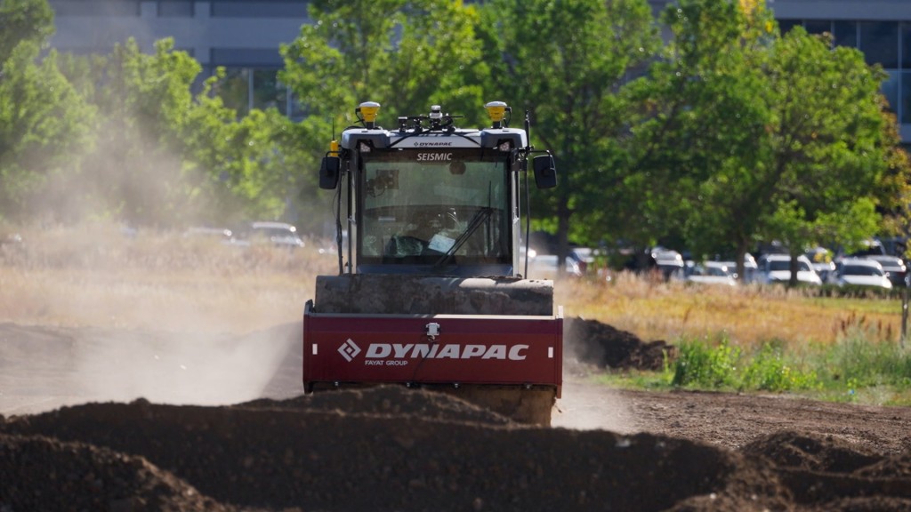 A compactor equipped with path planning software operates on a job site