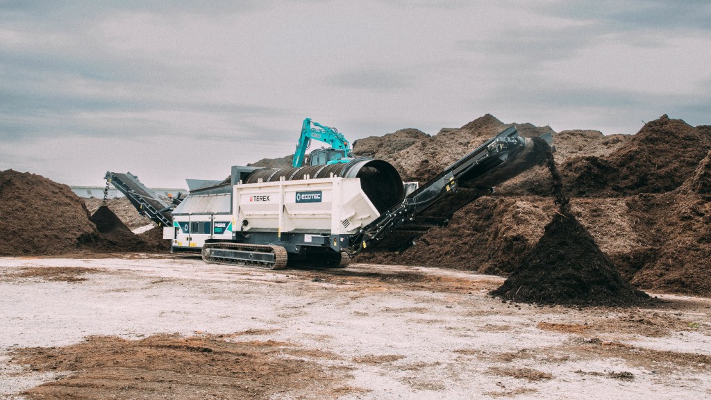 A trommel screen screens contaminants out of soil