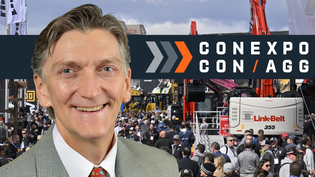 Eric Sauvage on a CONEXPO-CON/AGG banner