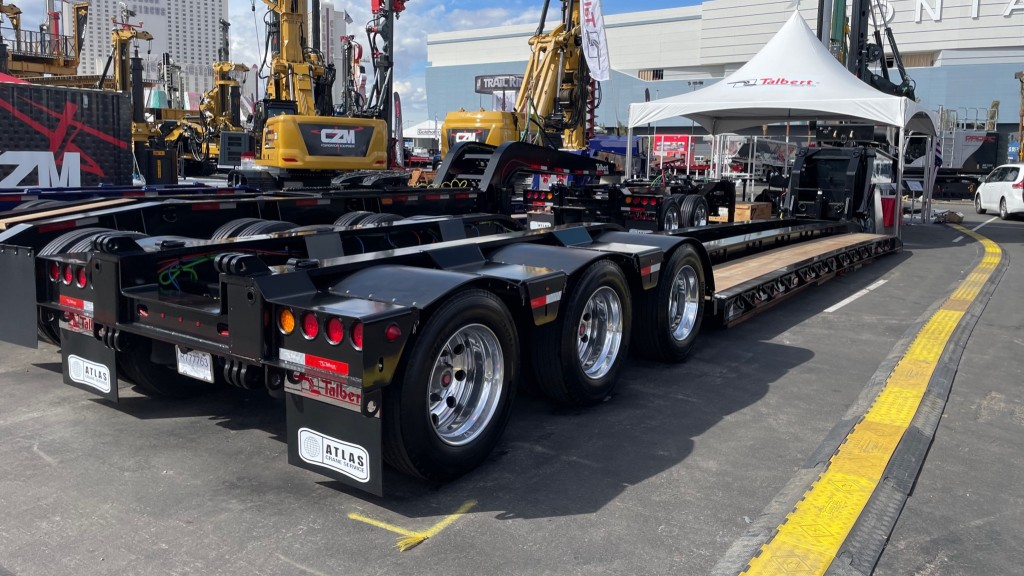 A trailer is parked at a trade show