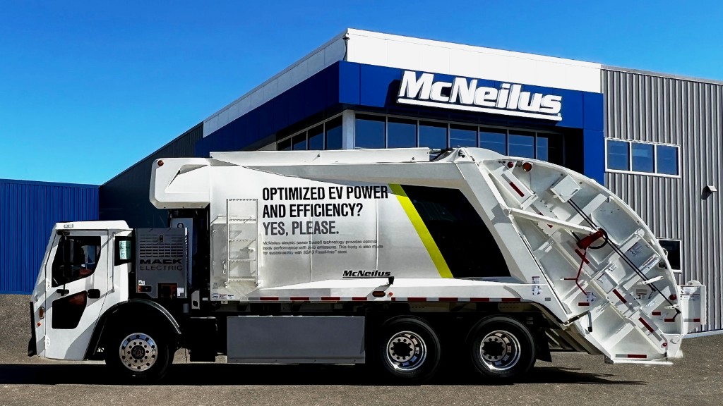 A collection vehicle is parked outside a McNeilus facility