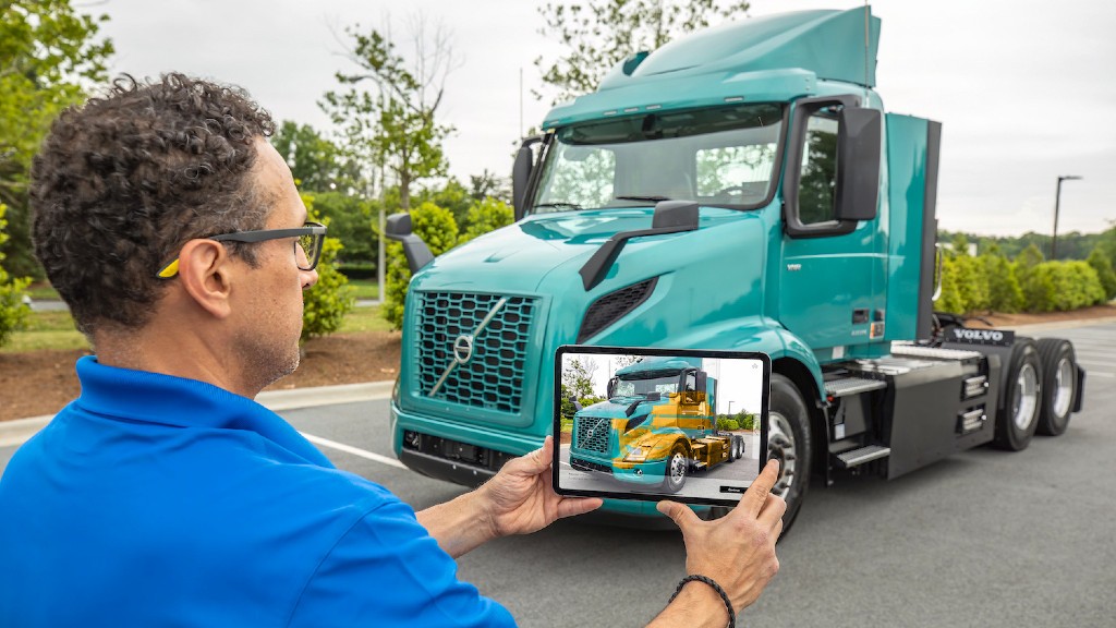 An augmented reality app shows a truck on its screen